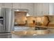 Bright kitchen featuring stainless steel appliances and neutral countertops at 10385 E Ida Ave, Greenwood Village, CO 80111