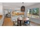 Bright kitchen with granite countertops and stainless appliances, and dining area with a view at 10385 E Ida Ave, Greenwood Village, CO 80111