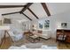 Cozy living room featuring hardwood floors, natural light, and comfortable furnishings at 10385 E Ida Ave, Greenwood Village, CO 80111