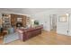 Open living room with stone fireplace, hardwood floors, and comfortable furniture at 10385 E Ida Ave, Greenwood Village, CO 80111