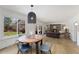 Inviting living room featuring a stone fireplace, hardwood floors, and ample natural light at 10385 E Ida Ave, Greenwood Village, CO 80111