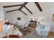 Inviting living room with exposed beams, hardwood floors, and comfortable seating at 10385 E Ida Ave, Greenwood Village, CO 80111