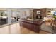 Spacious living room with hardwood floors, stone fireplace, and comfortable seating at 10385 E Ida Ave, Greenwood Village, CO 80111