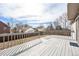 Home back deck with wooden railing, overlooking the backyard at 13504 Pecos St, Westminster, CO 80234