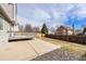 Backyard featuring a concrete patio with gravel border and wood fence at 13504 Pecos St, Westminster, CO 80234