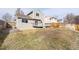 Backyard featuring a concrete patio, wood deck, and grass lawn at 13504 Pecos St, Westminster, CO 80234