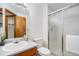 Bright bathroom featuring a shower with sliding glass doors and wood vanity at 13504 Pecos St, Westminster, CO 80234