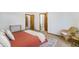 Comfortable bedroom featuring natural light, neutral carpeting, and en suite bathroom at 13504 Pecos St, Westminster, CO 80234