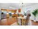 Bright eat-in kitchen features stainless steel appliances, ample counter space, and sliding doors to the outdoor deck at 13504 Pecos St, Westminster, CO 80234