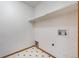 Laundry room with retro tile flooring, a single shelf, and utility hookups at 13504 Pecos St, Westminster, CO 80234