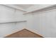 A walk-in closet with white walls and brown carpet at 13504 Pecos St, Westminster, CO 80234