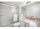 Bathroom featuring sliding glass door, granite countertop, and white vanity at 19 Benthaven Pl, Boulder, CO 80305