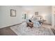 Bright bedroom featuring neutral decor, a patterned rug, and sitting bench at 19 Benthaven Pl, Boulder, CO 80305