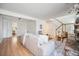 Bright living room with stairs, neutral sofa, and open layout leading to the kitchen, ideal for modern living at 19 Benthaven Pl, Boulder, CO 80305