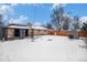 Backyard with covered patio, swing set, and shed at 460 Iola St, Aurora, CO 80010