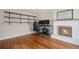 Bright living room with hardwood floors, fireplace, and sliding glass doors at 460 Iola St, Aurora, CO 80010