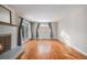 Bright living room with hardwood floors, fireplace, and sliding glass doors at 460 Iola St, Aurora, CO 80010