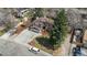 Aerial view of a home showcasing its well-manicured front yard, driveway, and inviting facade at 8170 S Marshall Ct, Littleton, CO 80128
