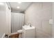 Contemporary bathroom with tiled walls, modern vanity, and a shower featuring stylish shower curtain at 8170 S Marshall Ct, Littleton, CO 80128