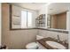 Updated bathroom with tasteful tile accents, granite vanity, and modern fixtures at 8170 S Marshall Ct, Littleton, CO 80128