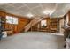 Spacious garage space with unfinished walls, high ceilings, a staircase, and ample storage at 8170 S Marshall Ct, Littleton, CO 80128