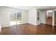 Bright living space featuring hardwood floors, sliding glass doors and easy access to the backyard at 8170 S Marshall Ct, Littleton, CO 80128