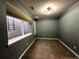 Finished basement bedroom with window and neutral carpet flooring at 9377 Longstone Dr, Parker, CO 80134