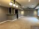 Finished basement area includes neutral carpet and a wet bar, perfect for entertaining at 9377 Longstone Dr, Parker, CO 80134