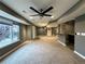 Finished basement featuring neutral carpet, a bar, and plenty of natural light from a window at 9377 Longstone Dr, Parker, CO 80134