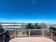 Enjoy beautiful lake views from this spacious deck, perfect for outdoor relaxation and entertaining at 9377 Longstone Dr, Parker, CO 80134