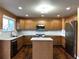 Modern kitchen boasts stainless steel appliances, granite countertops, and a functional center island at 9377 Longstone Dr, Parker, CO 80134