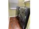 Laundry room features a modern washer and dryer set, with wood floors and neutral paint at 9377 Longstone Dr, Parker, CO 80134