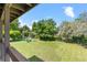 Expansive backyard with lush lawn, mature trees, and space for outdoor recreation at 8333 Depew Way, Arvada, CO 80003