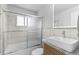 Updated bathroom featuring a vessel sink, modern fixtures, and shower-tub combination at 8333 Depew Way, Arvada, CO 80003