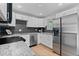 Sleek kitchen equipped with stainless steel appliances, granite countertops, and ample cabinet space at 8333 Depew Way, Arvada, CO 80003