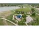 Picturesque park view featuring a playground, lake, and walking paths, ideal for outdoor recreation at 8333 Depew Way, Arvada, CO 80003