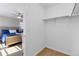 An open closet with hardwood floors and rack for hanging clothes is attached to this bedroom at 27798 E 7Th Pl, Aurora, CO 80018