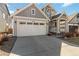 Beautiful two-story home showcasing a two-car garage and a covered porch with decorative flower boxes at 27798 E 7Th Pl, Aurora, CO 80018