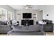 Comfortable living room showcasing neutral walls, stylish sofas, and ample natural light at 27798 E 7Th Pl, Aurora, CO 80018