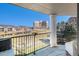 Enjoy breathtaking views from this condo's balcony, overlooking lush greenery and nearby buildings at 2896 W Riverwalk Cir # A214, Littleton, CO 80123