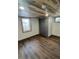 Basement bedroom with wood ceiling and floors, plus a closet and modern windows at 2814 S Winona Ct, Denver, CO 80236