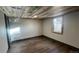 Finished basement features wood ceiling and floors, plus a modern window at 2814 S Winona Ct, Denver, CO 80236