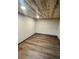 A bedroom featuring a unique wooden ceiling, complementing the modern flooring and minimalist design at 2814 S Winona Ct, Denver, CO 80236