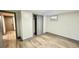 Basement bedroom featuring wood flooring and a closet at 2814 S Winona Ct, Denver, CO 80236