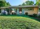 Charming single-story home featuring a lush green lawn and a well-maintained exterior at 2814 S Winona Ct, Denver, CO 80236