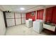 Functional laundry area with ample storage cabinets and a utility sink next to the washer and dryer at 2814 S Winona Ct, Denver, CO 80236