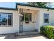 Charming front entrance of a single-story home with a covered porch and manicured bushes at 1170 Kingston St, Aurora, CO 80010