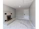 Neutral living room featuring marble floors, a brick fireplace, and a back door at 1170 Kingston St, Aurora, CO 80010