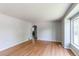 Bright living room with hardwood floors and a large window providing ample natural light at 1170 Kingston St, Aurora, CO 80010