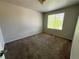Neutral colored bedroom with carpeted floor, window for natural light, and ample room for furniture at 20558 E Grand Ln, Aurora, CO 80015